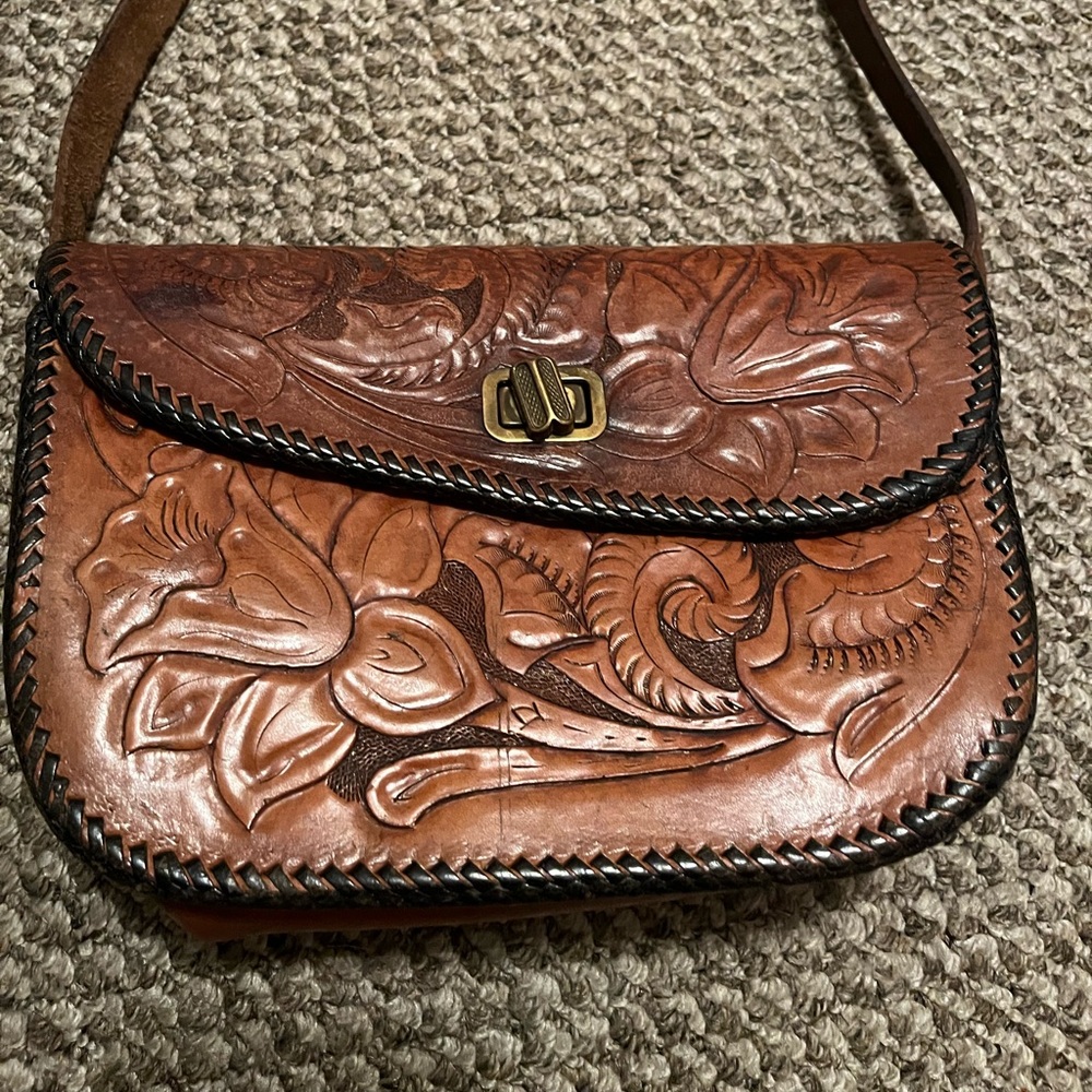Vintage leather shoulder bag with embossed flowers